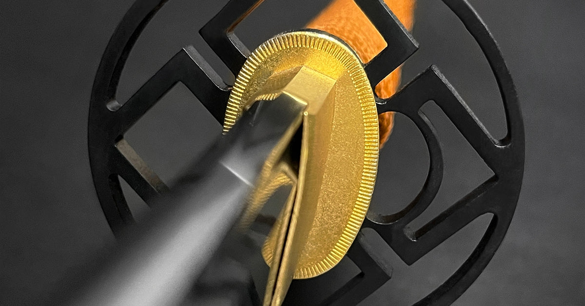 Gold coin being cut by a sword