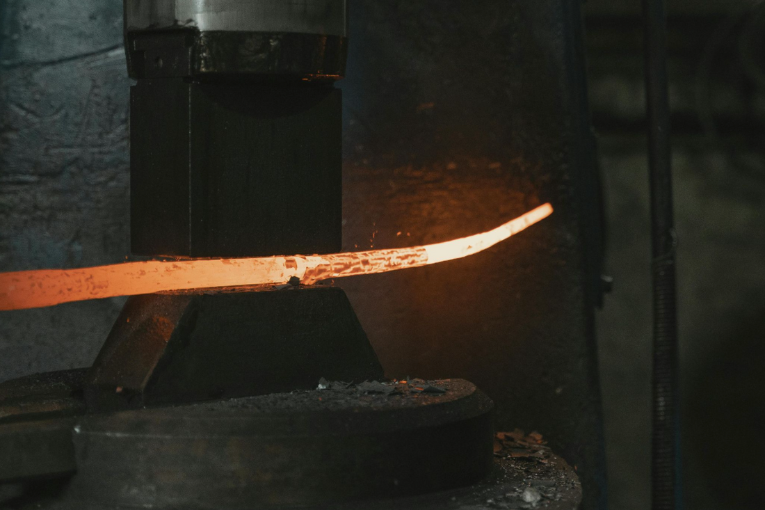 Forging a Damascus steel katana.
